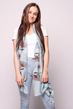 Load image into Gallery viewer, Woman wearing blue scarf with red fan flowers in