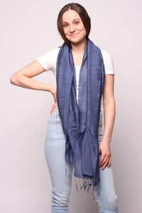 Woman wearing dark blue colored scarf