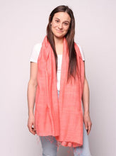 Load image into Gallery viewer, Woman wearing coral colored scarf
